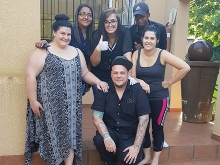 Skinart Training learners with their instructor