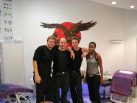 Body art learner receiving practical guidance